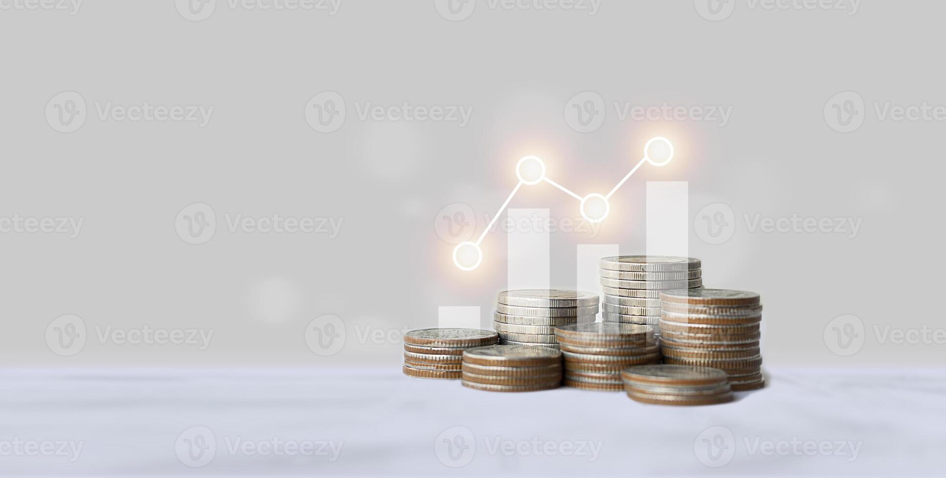 Stacks of coins and graphs financial concepts and financial investment business stock growth photo