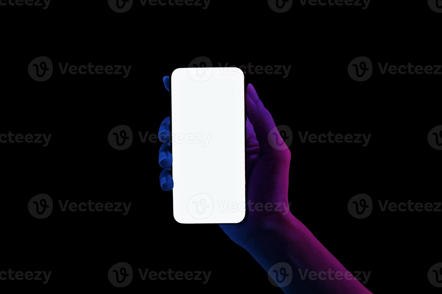 Hand shows blue and pink neon lights bezel-less smartphones blank screen on black background. photo