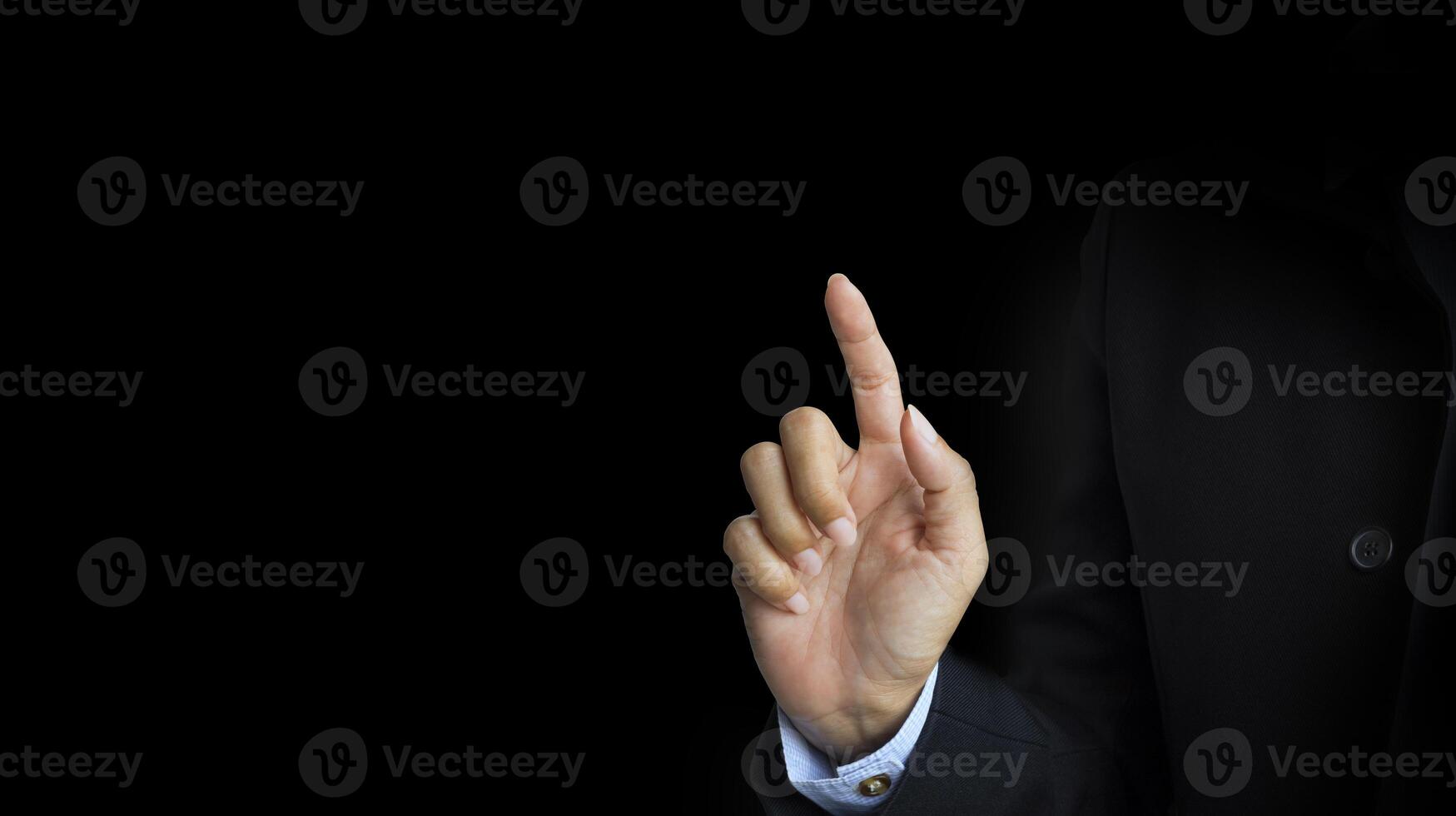 a man in a suit is pointing his finger photo