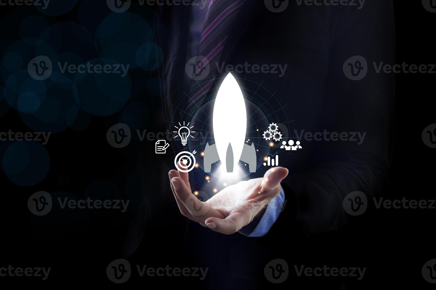 Startup business concept, Businessman holding tablet and icon transparent rocket is launching photo