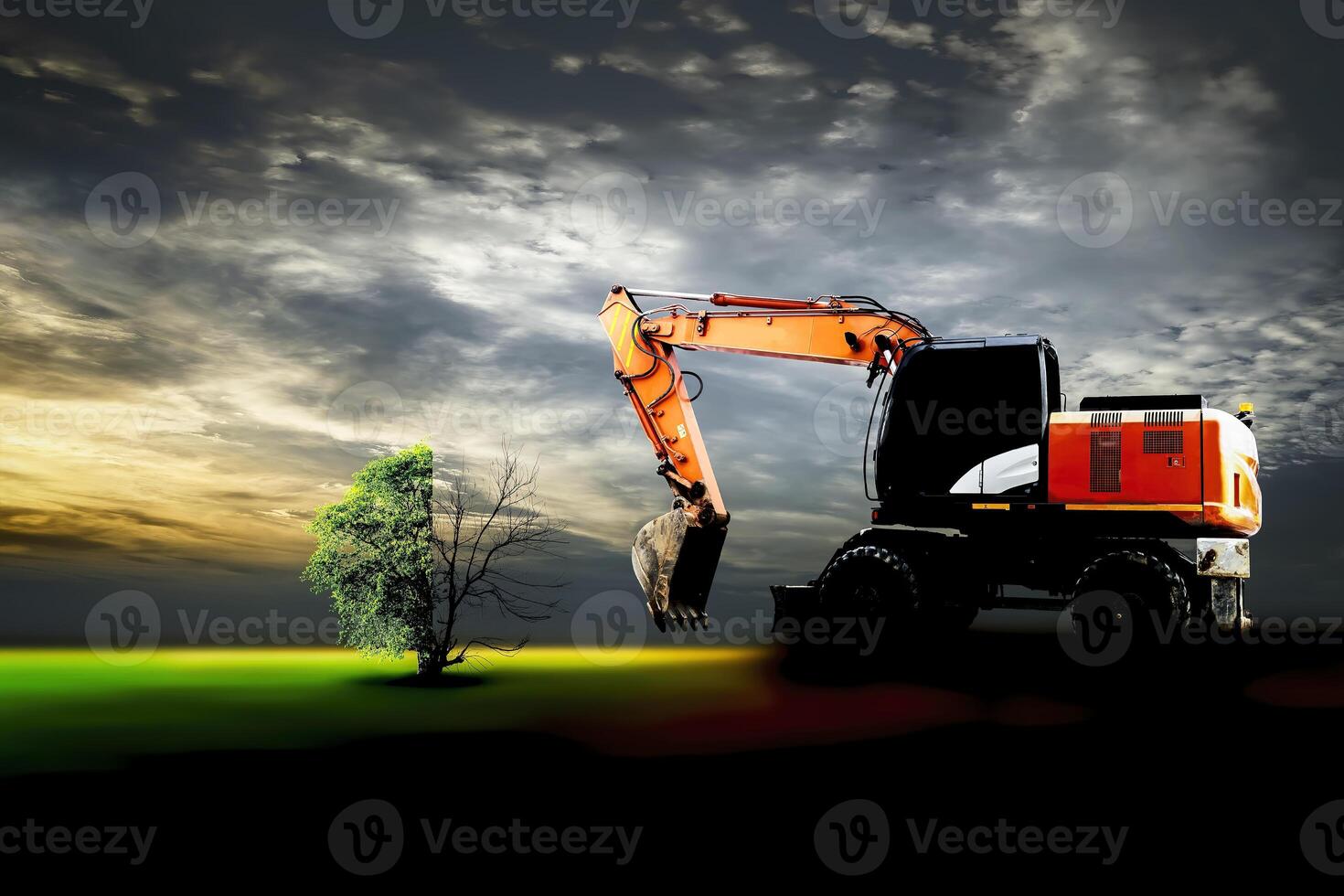 loader is trying to cut down a tree for construction photo