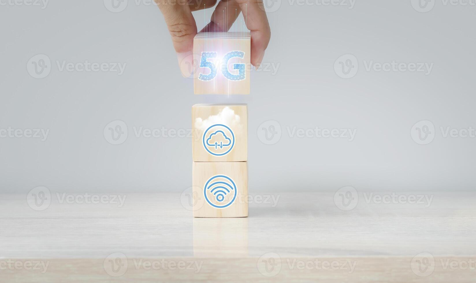 a person is holding a block with 5g on it photo