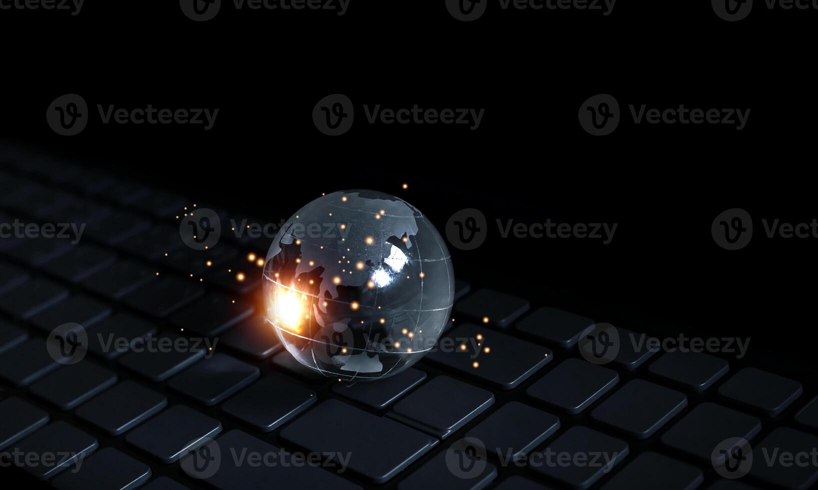 a computer keyboard with a glowing object on it photo