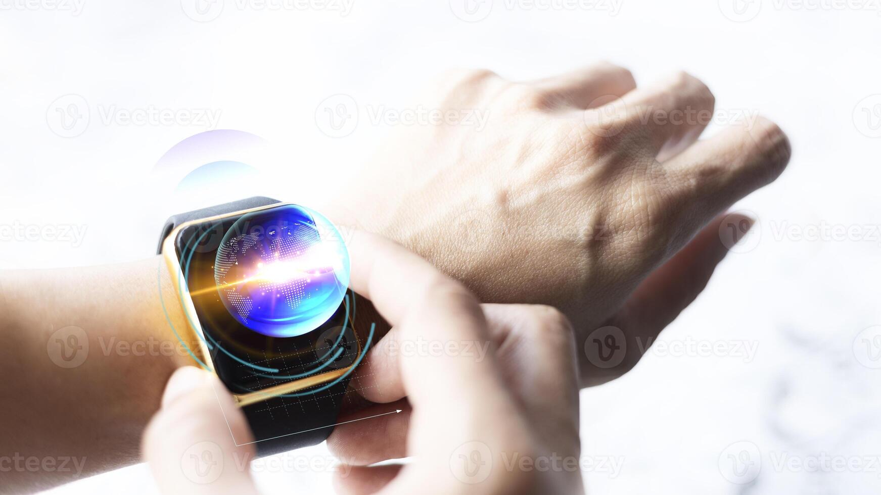 a person holding a smart watch with a blue and purple light photo