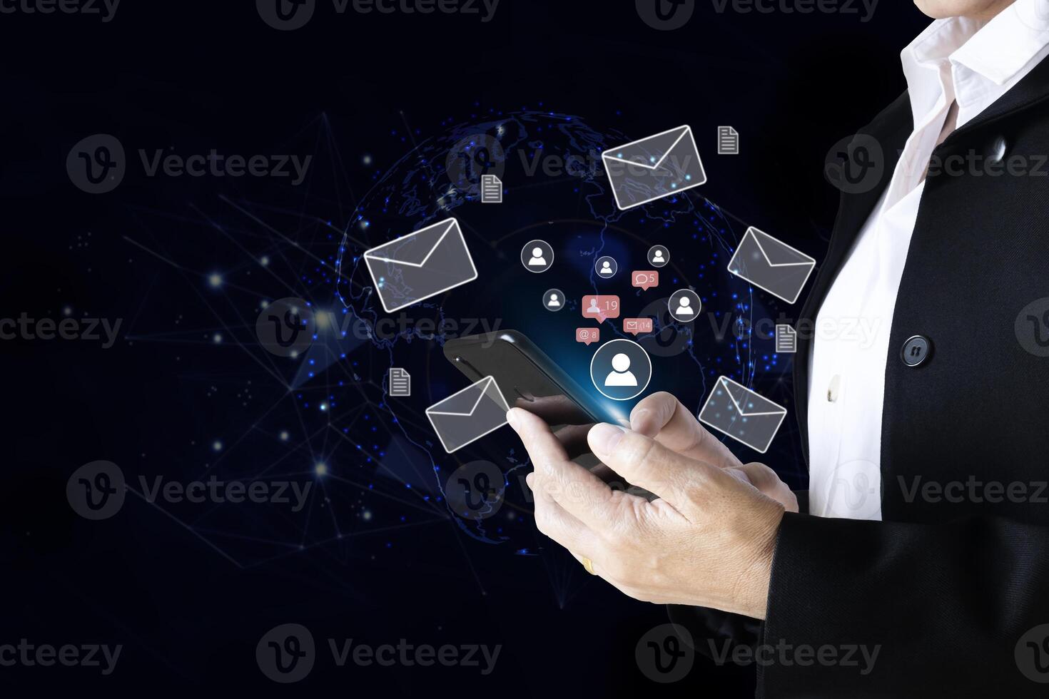 businessman holding smartphone with email icons on background photo