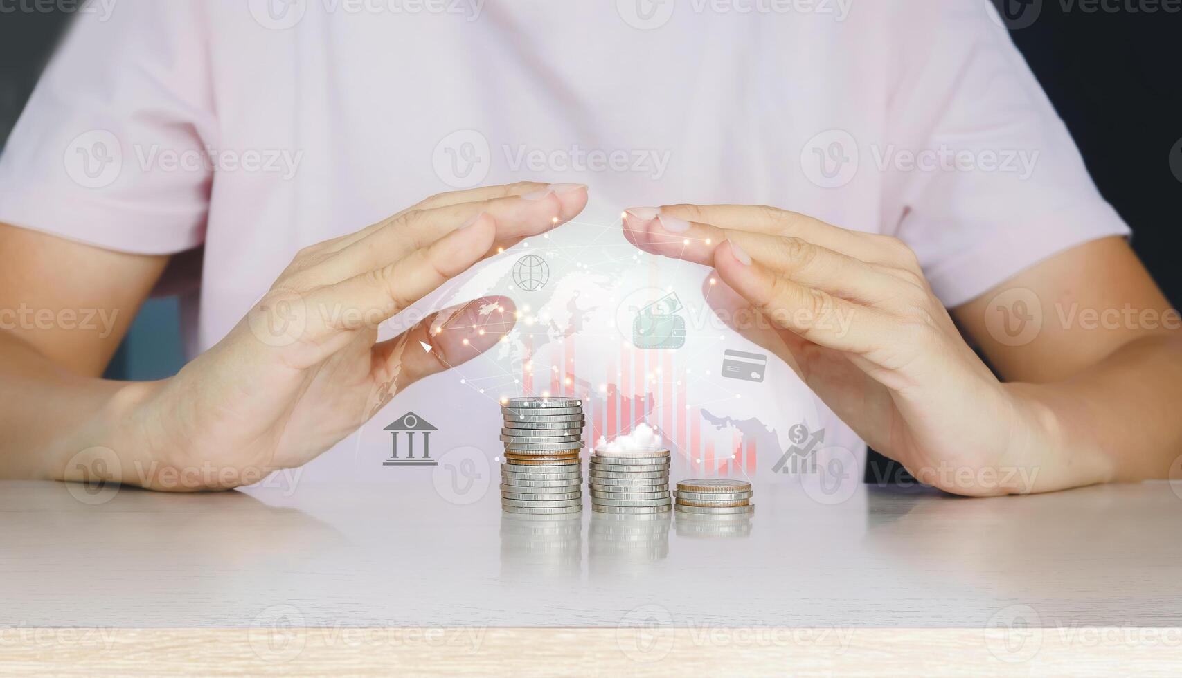 a person holding coins with a digital image of a house photo