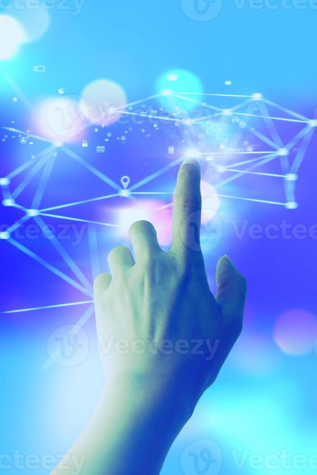 a hand pressing a button on a blue background photo