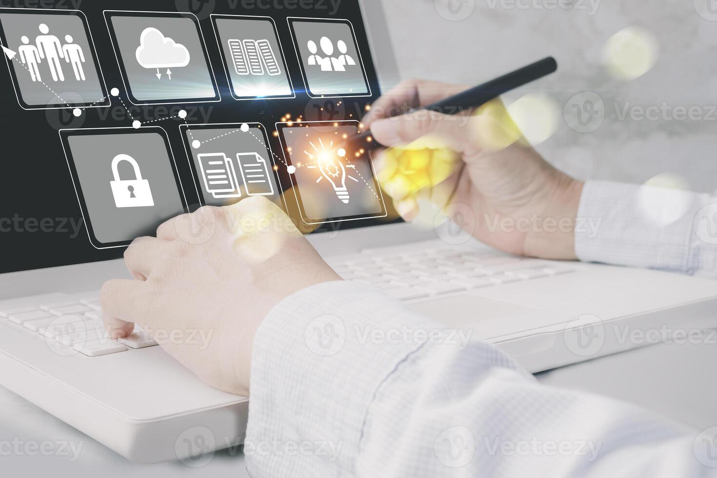 a person is using a laptop with icons on it photo