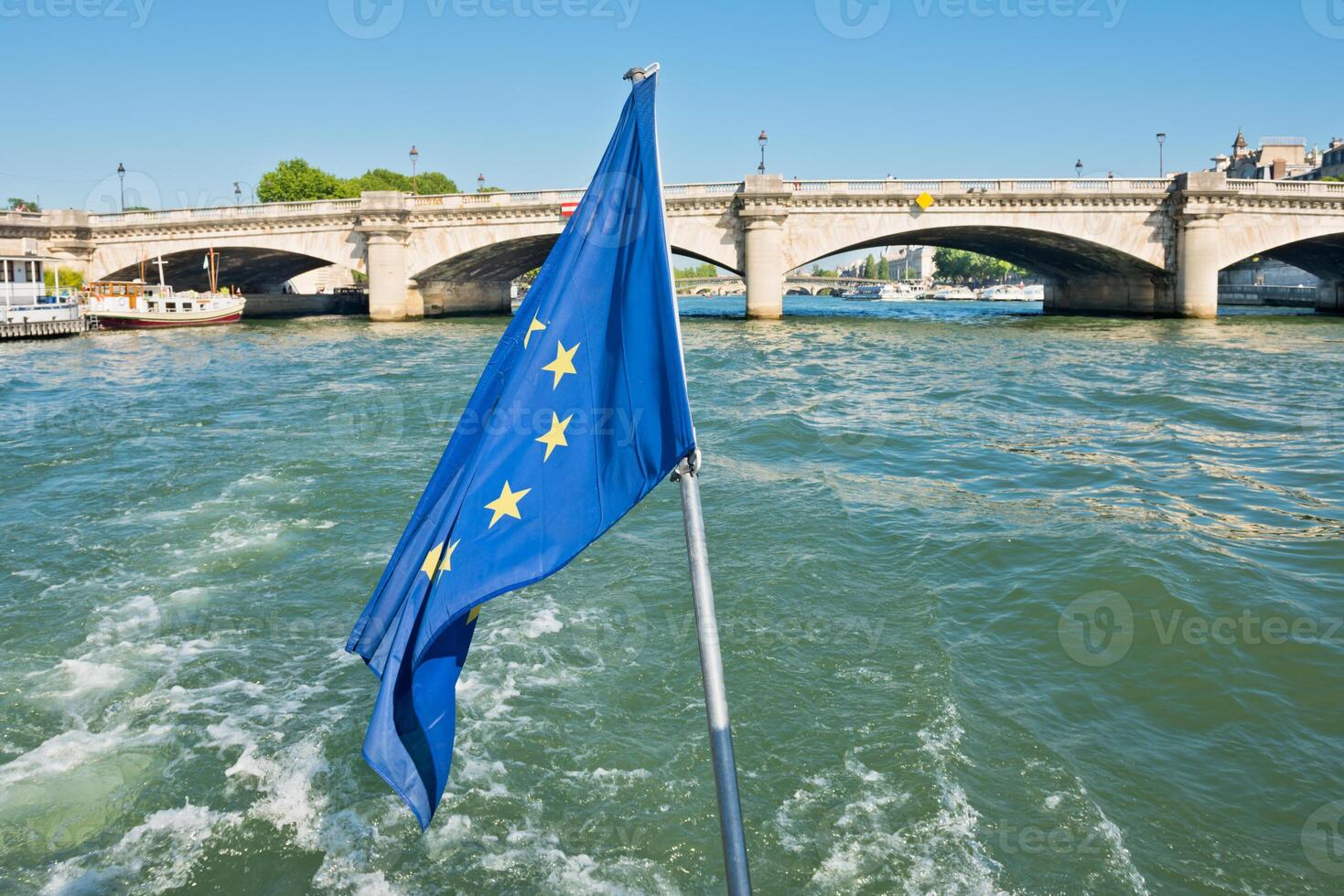 Flag of European Union waving in the wind on boat photo