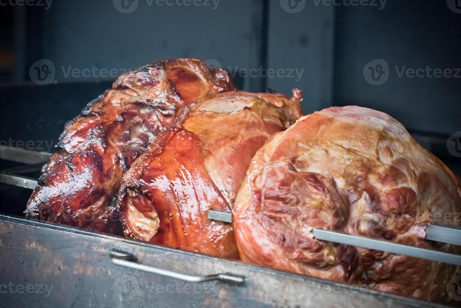 roasted pig knuckle on the spit photo