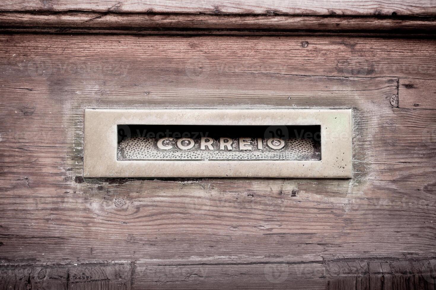 Letters slot at Old Wooden Door in Lisbon photo