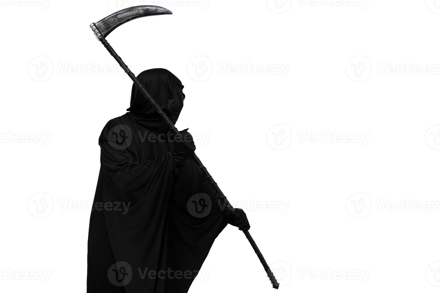 Grim reaper in Halloween costume threatening with scythe towards copyspace white background photo