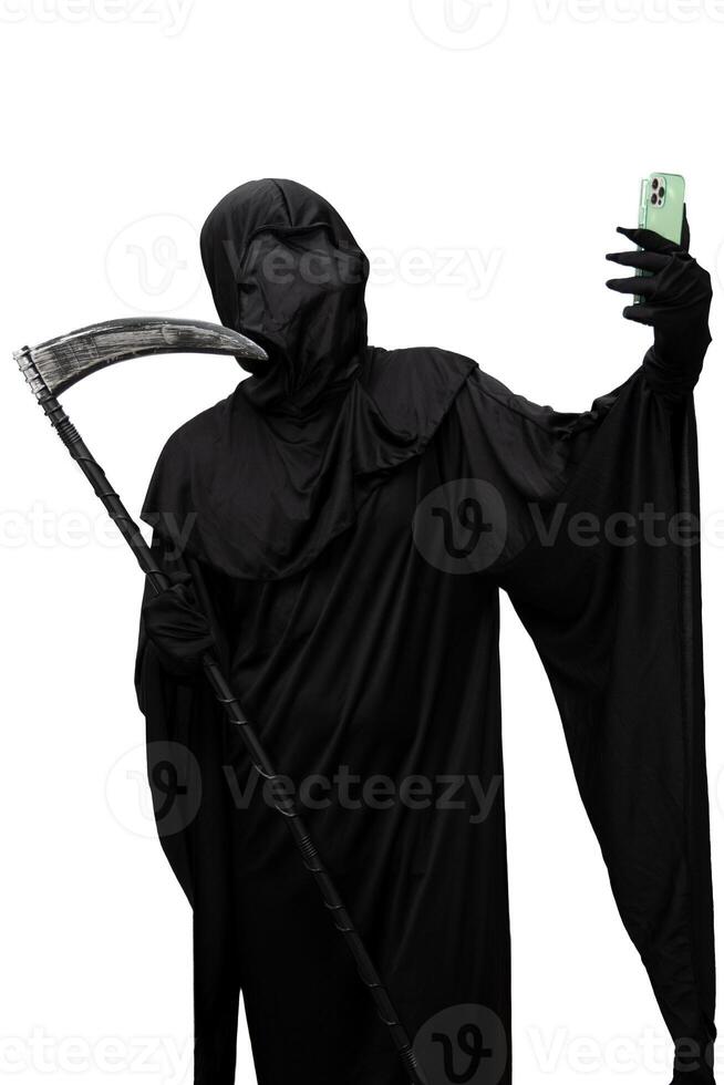 vertical Grim reaper in Halloween costume holding a scythe taking a selfie with a smartphone photo