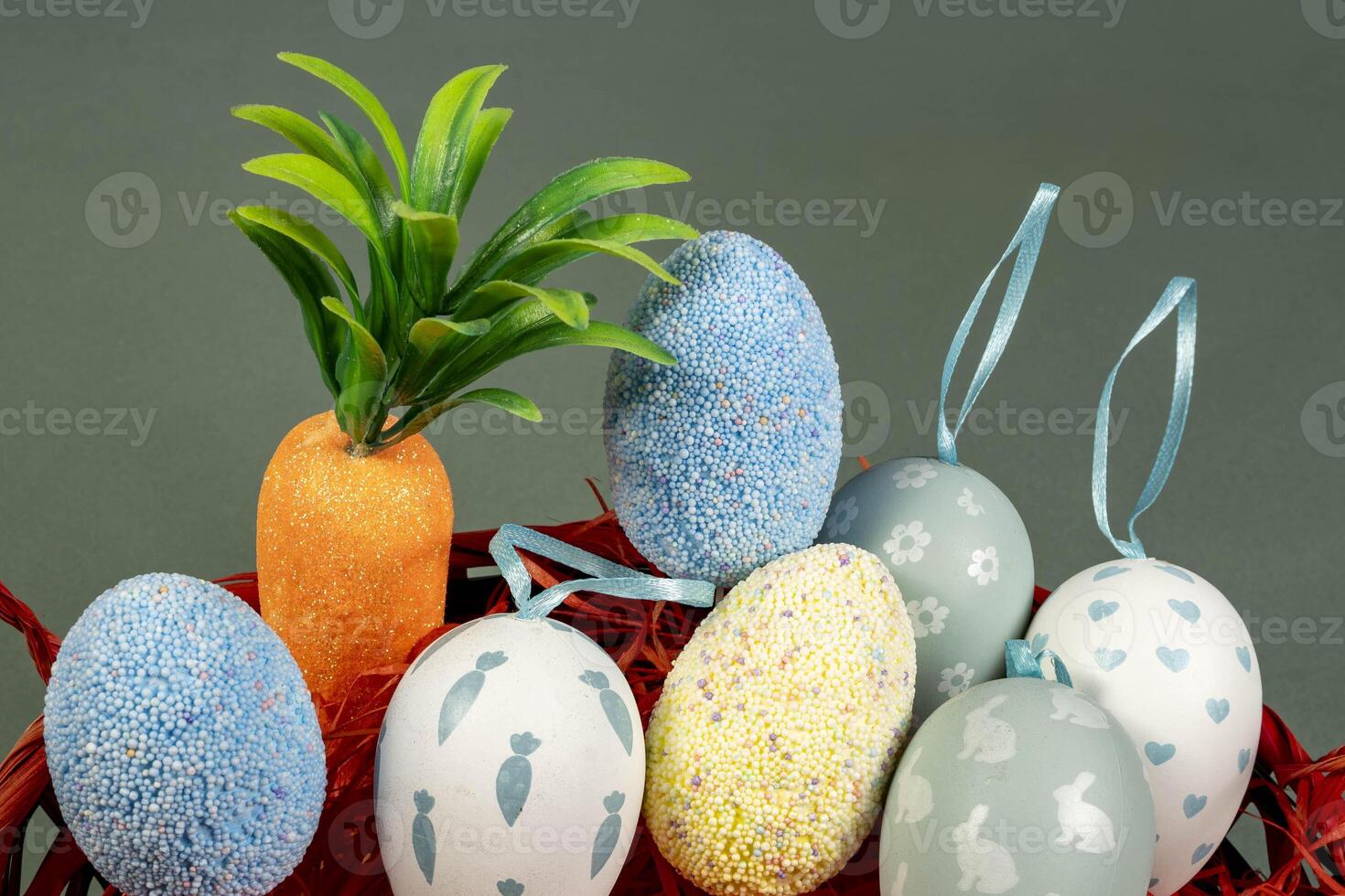 Easter eggs in a nest on a red background. The minimal concept. Top view. photo
