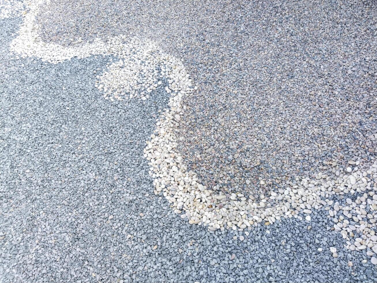 Two-tone pebble texture with wavy dividing lines. photo