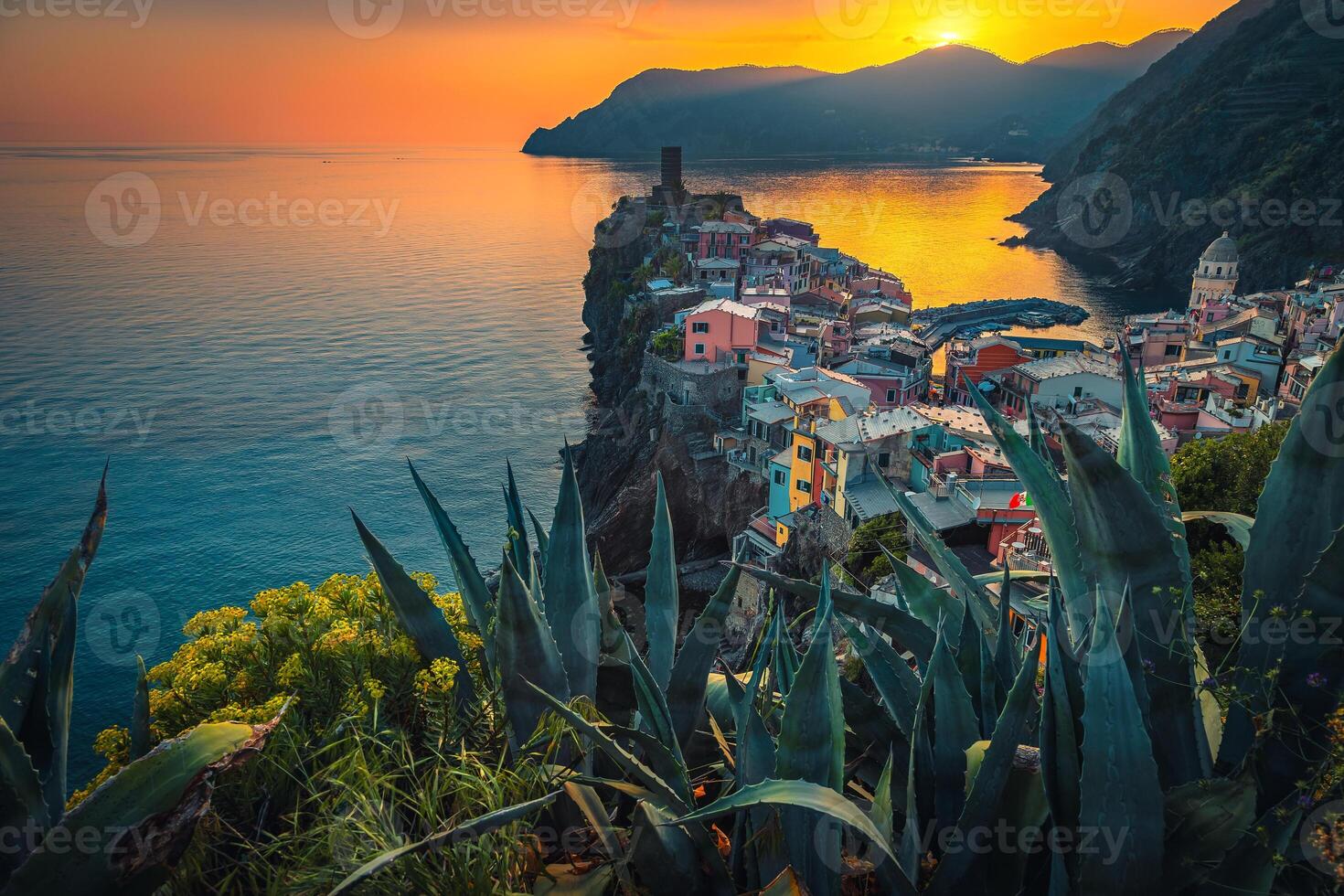 Amazing Vernazza village on the cliffs at sunset, Liguria, Italy photo