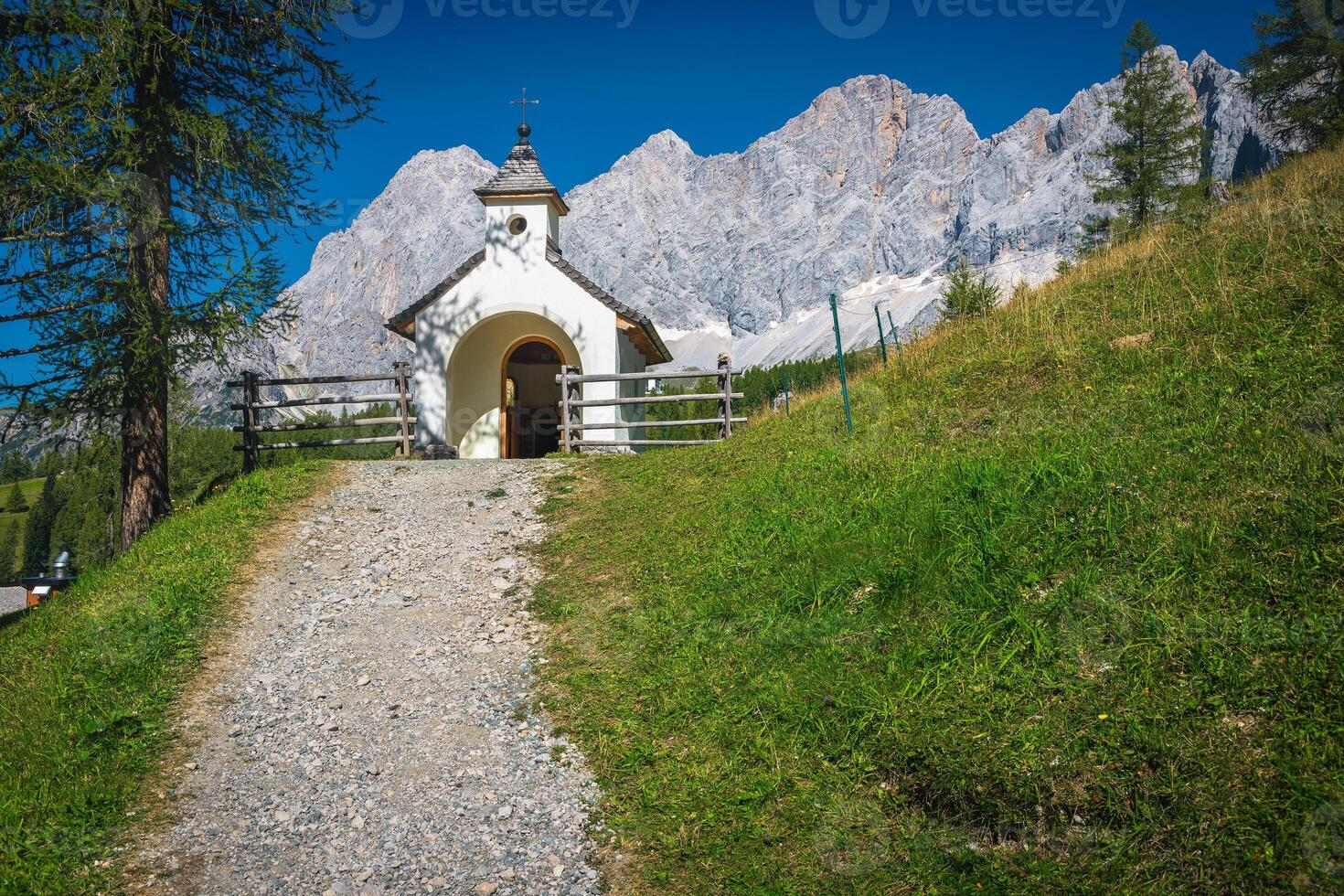 Small alpine chapel in the mountains, Ramsau am Dachstein, Austria photo