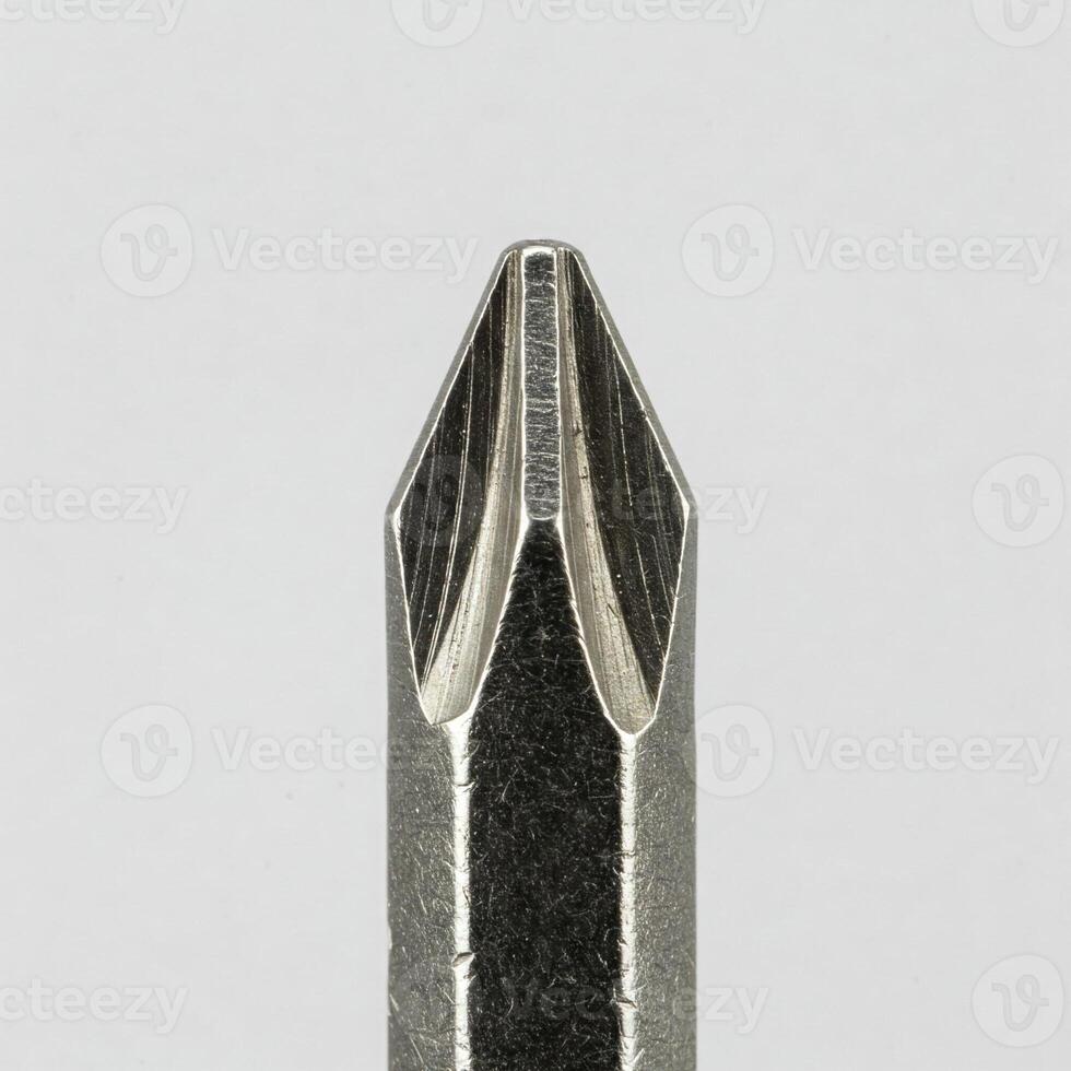 Closeup of a screw driver tip isolated on white photo