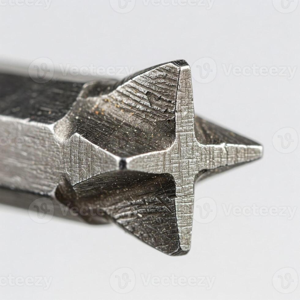 A closeup of a drill bit isolated on white photo