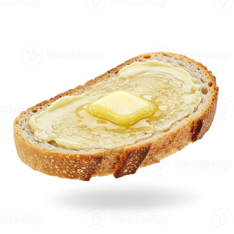 Butter melting on a slice of bread isolated on white photo