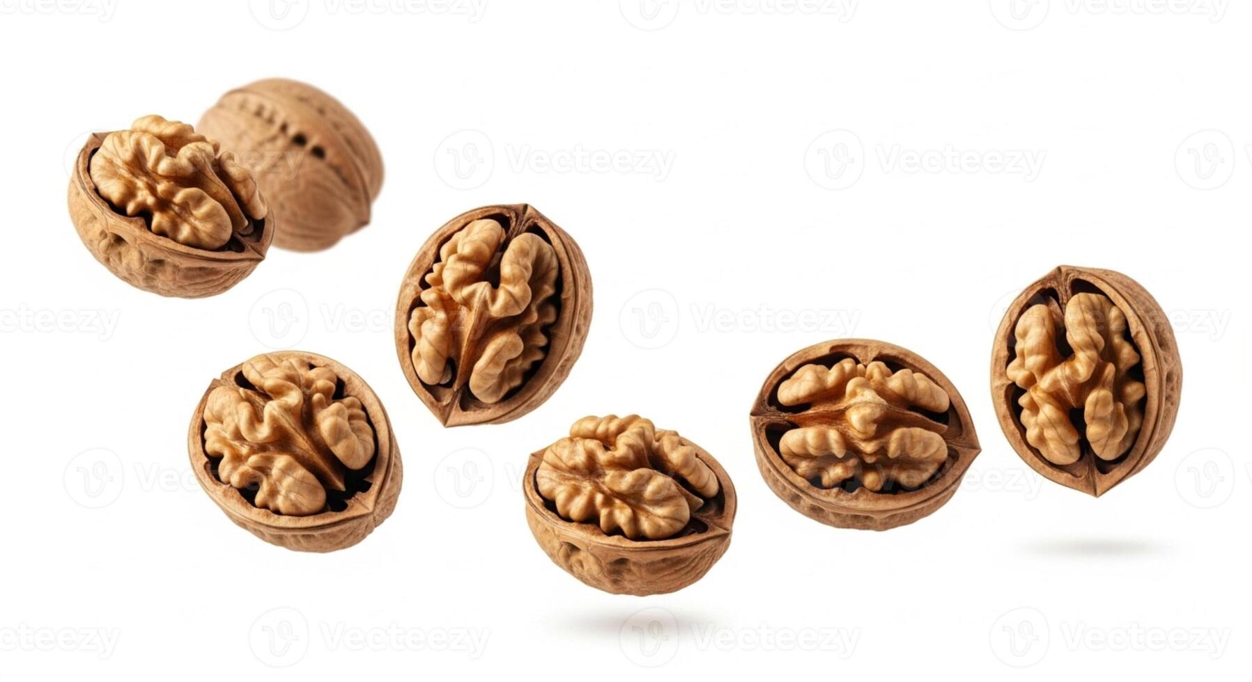 Cracked walnuts isolated on white photo