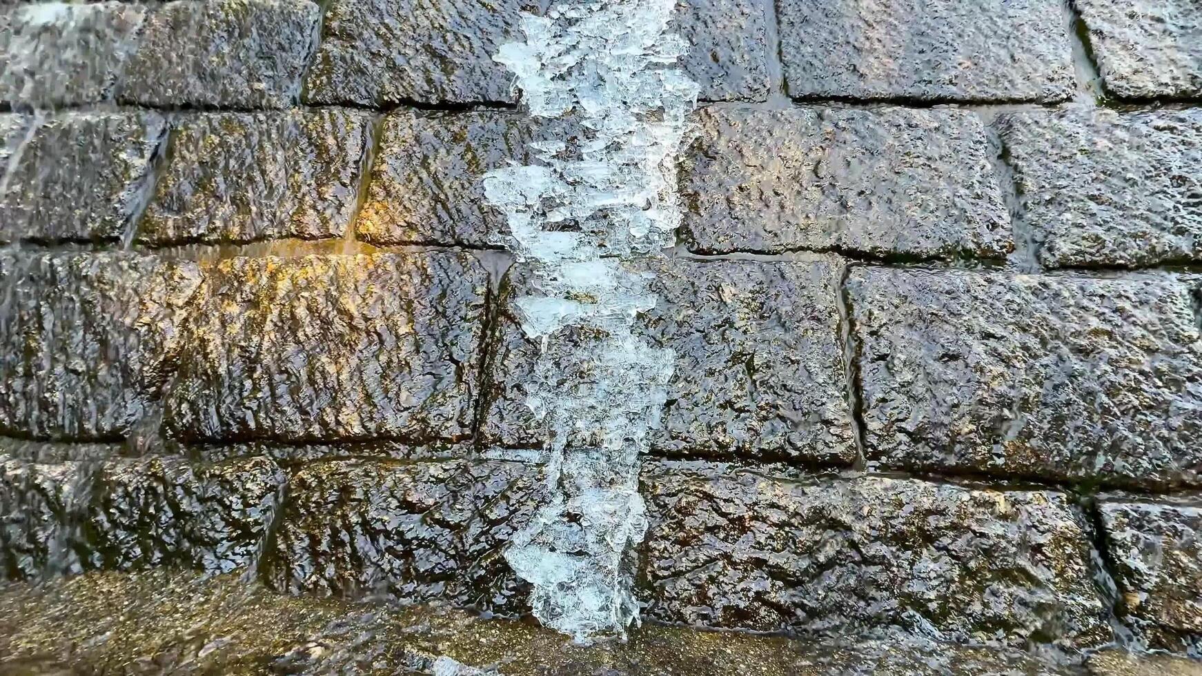 The Flowing Water Moving Over a Smooth Stone Surface Within a Beautiful Natural Environment photo
