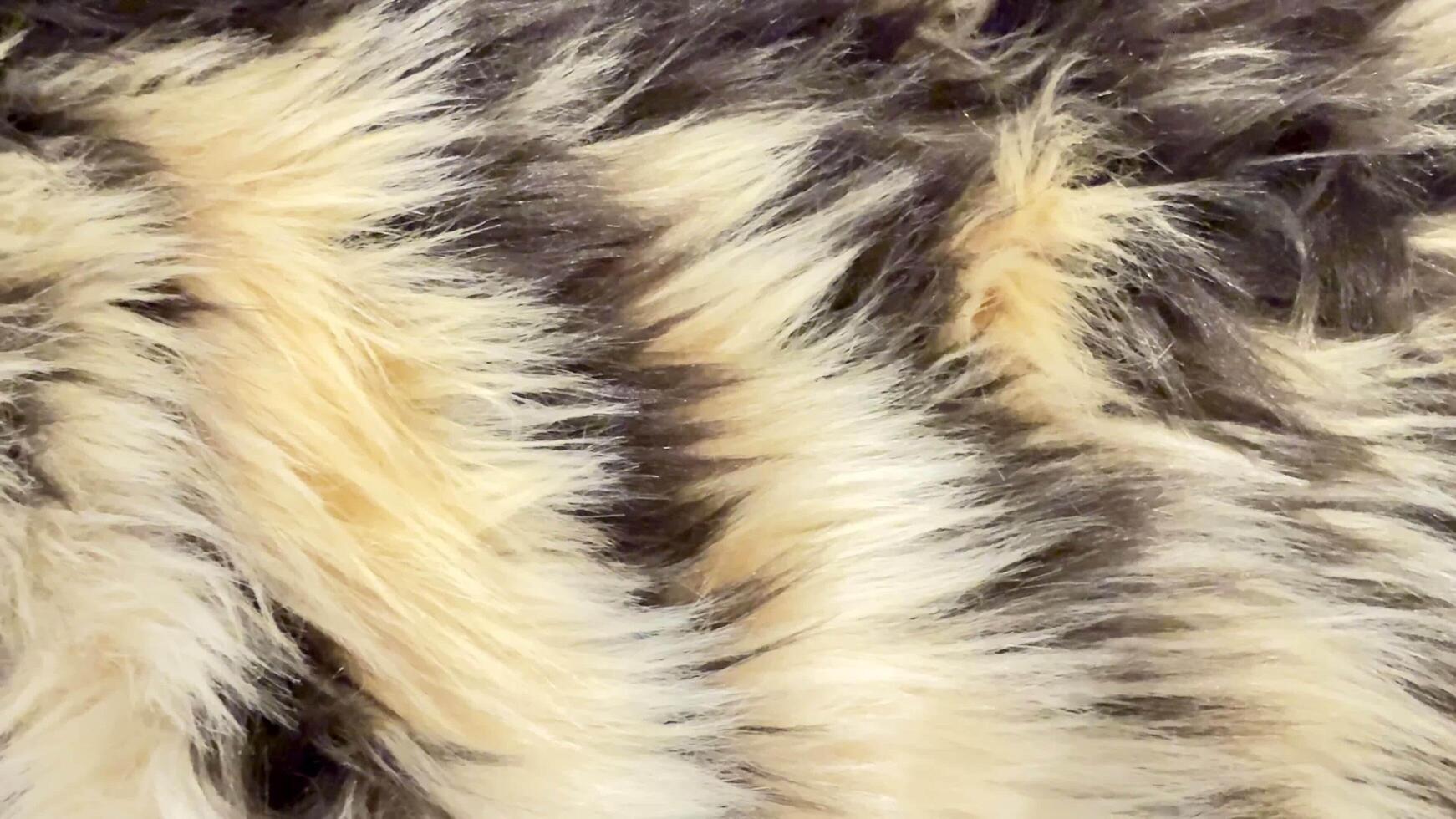A Beautifully Textured Fur Pattern That Showcases Elegant Natural Tones and Shades Throughout photo