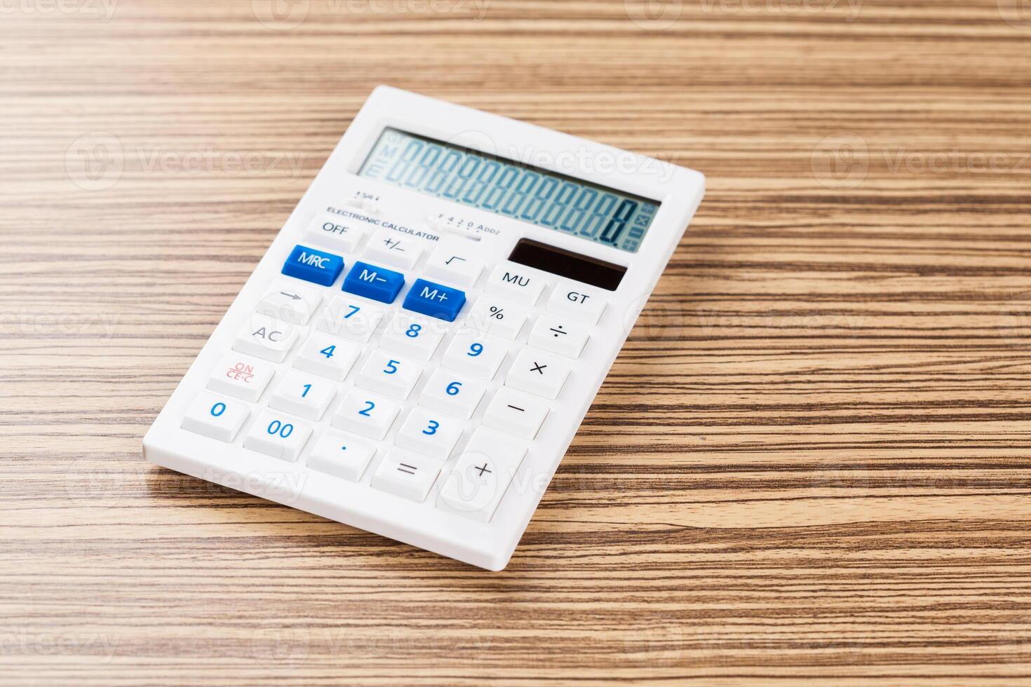 Digital calculator on table close-up photo