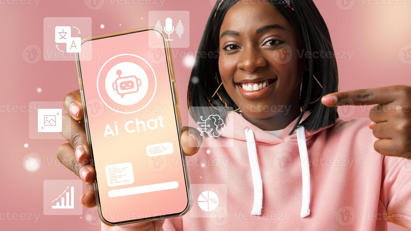 Young woman demonstrating AI chat application on smartphone against a pink background during a tech event photo