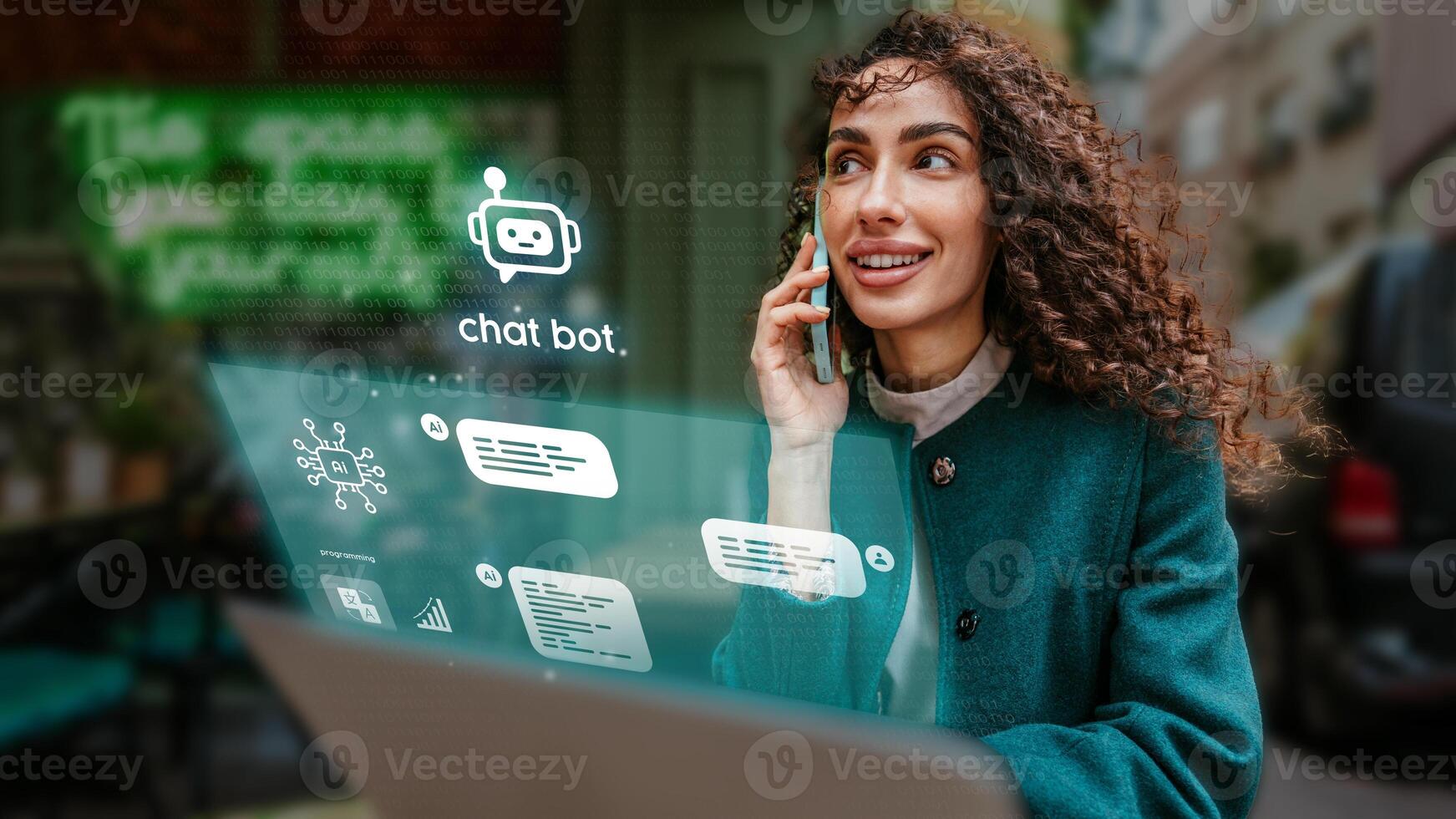 Woman engaged in conversation while using laptop in urban setting showcasing modern technology and communication tools photo