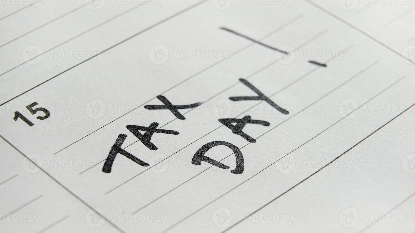 Important tax day reminder written in a calendar for April 15 deadline photo