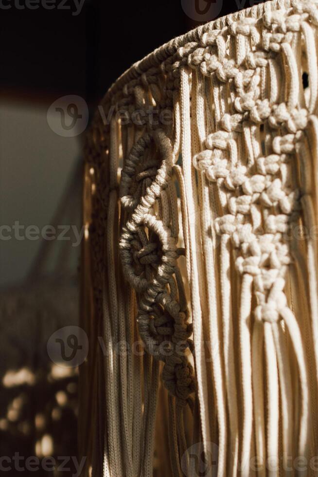 Handmade macrame art displayed in a cozy indoor space with natural light in the afternoon photo