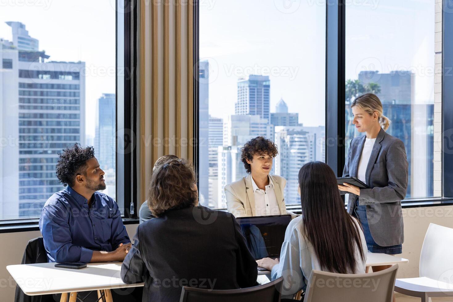 Caucasian woman sale manager is showing annual report to her colleagues in executive meeting for next year plan with market share increase for global business and investment usage photo