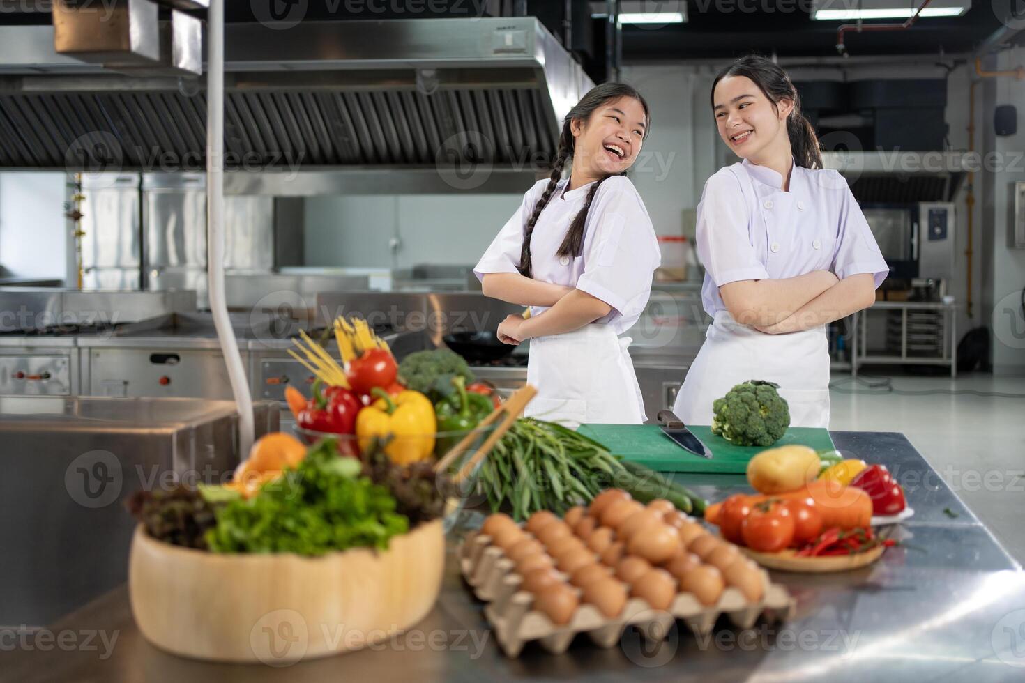 Culinary school student is posing inside the kitchen with fresh ingredient for cooking class school and education photo