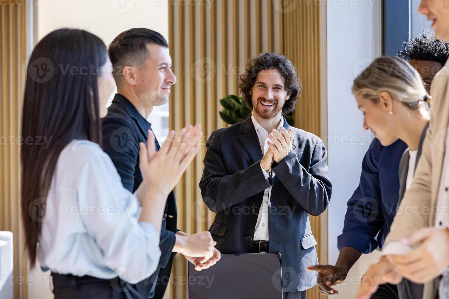 Team of happy diversity business people having agreement on deal over new strategic strategy project on investment real estate with recognition and applause from other colleague for partnership photo