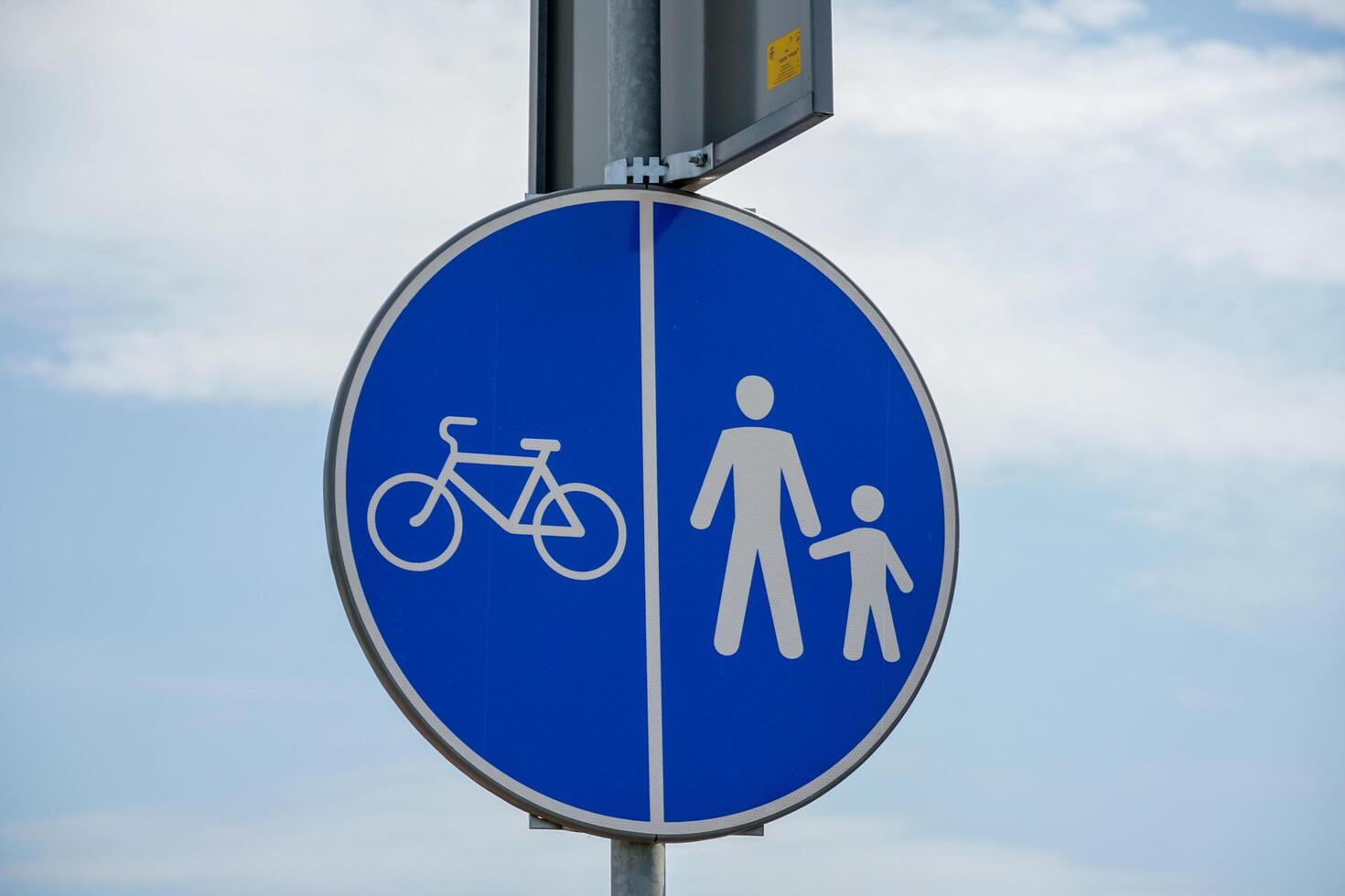 A blue and white sign with a man and child photo