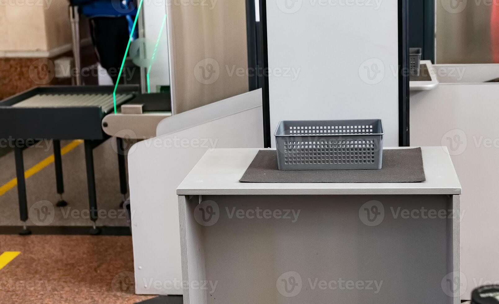 Security checkpoint with conveyor belt and inspection area in busy public space providing safety measures photo