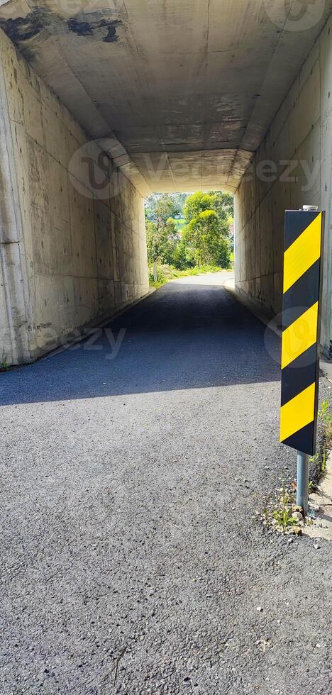 Close-up of emergency signs at the tunnel entrance in a Portugal. road construction concept. safety engineering, warning signals, collapse photo