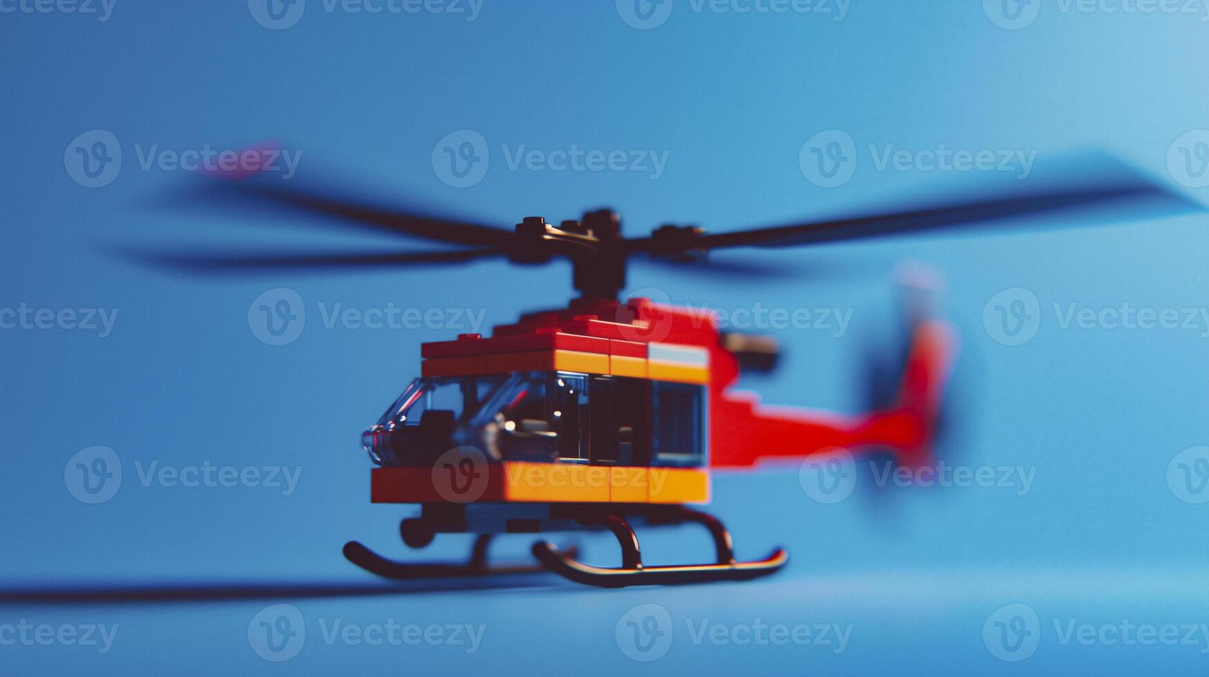 A toy helicopter on a blue background photo