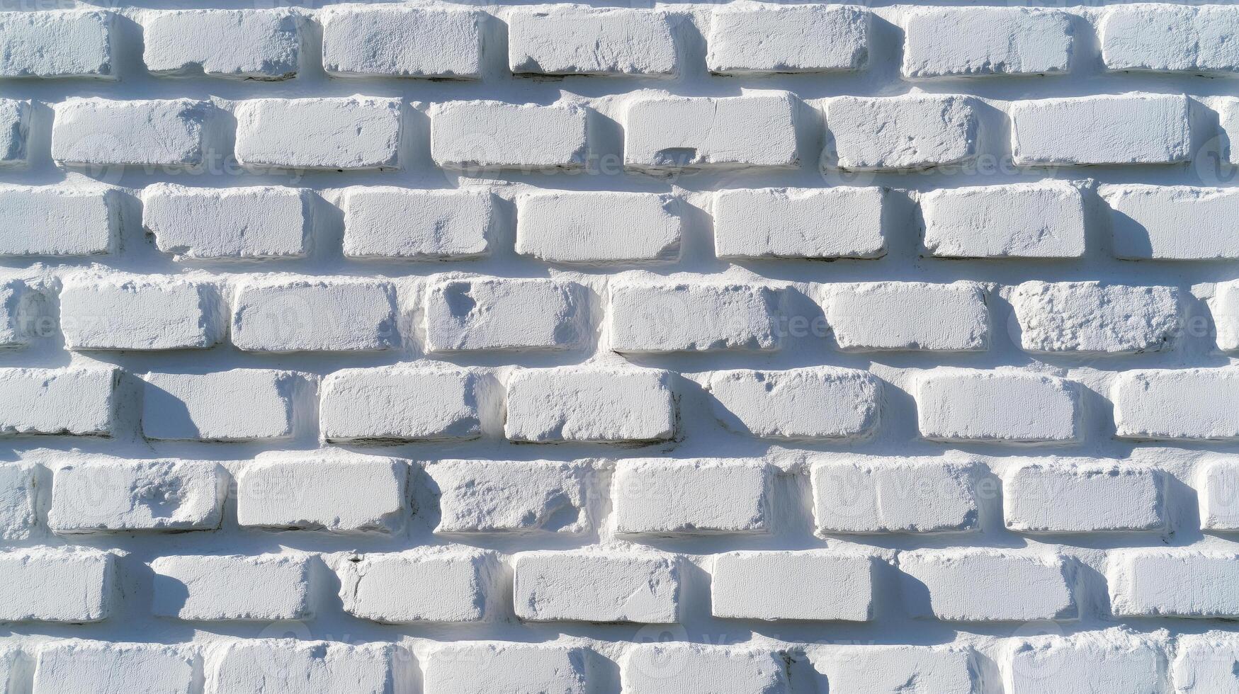 A white wall with many small squares on it photo