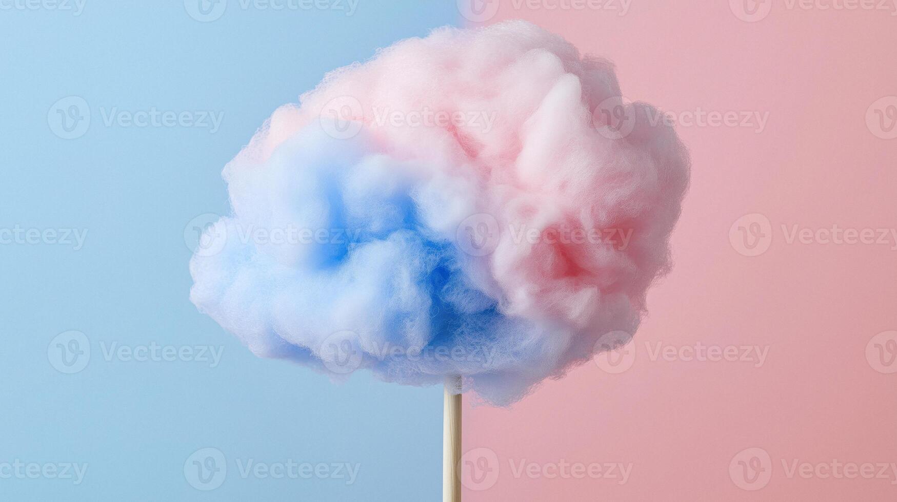 A cotton candy on a stick with blue and pink clouds photo
