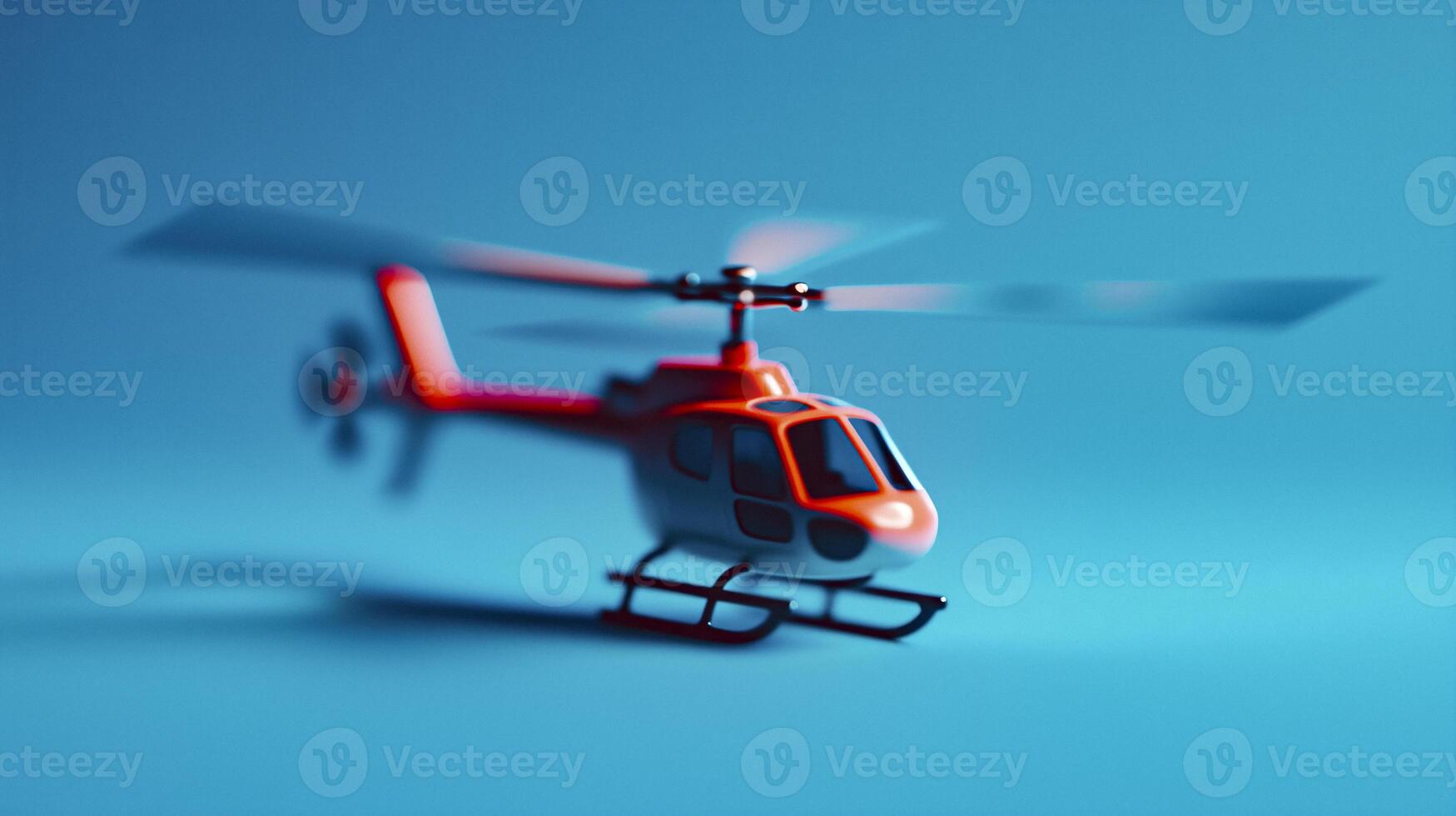 A small red helicopter flying in the air photo