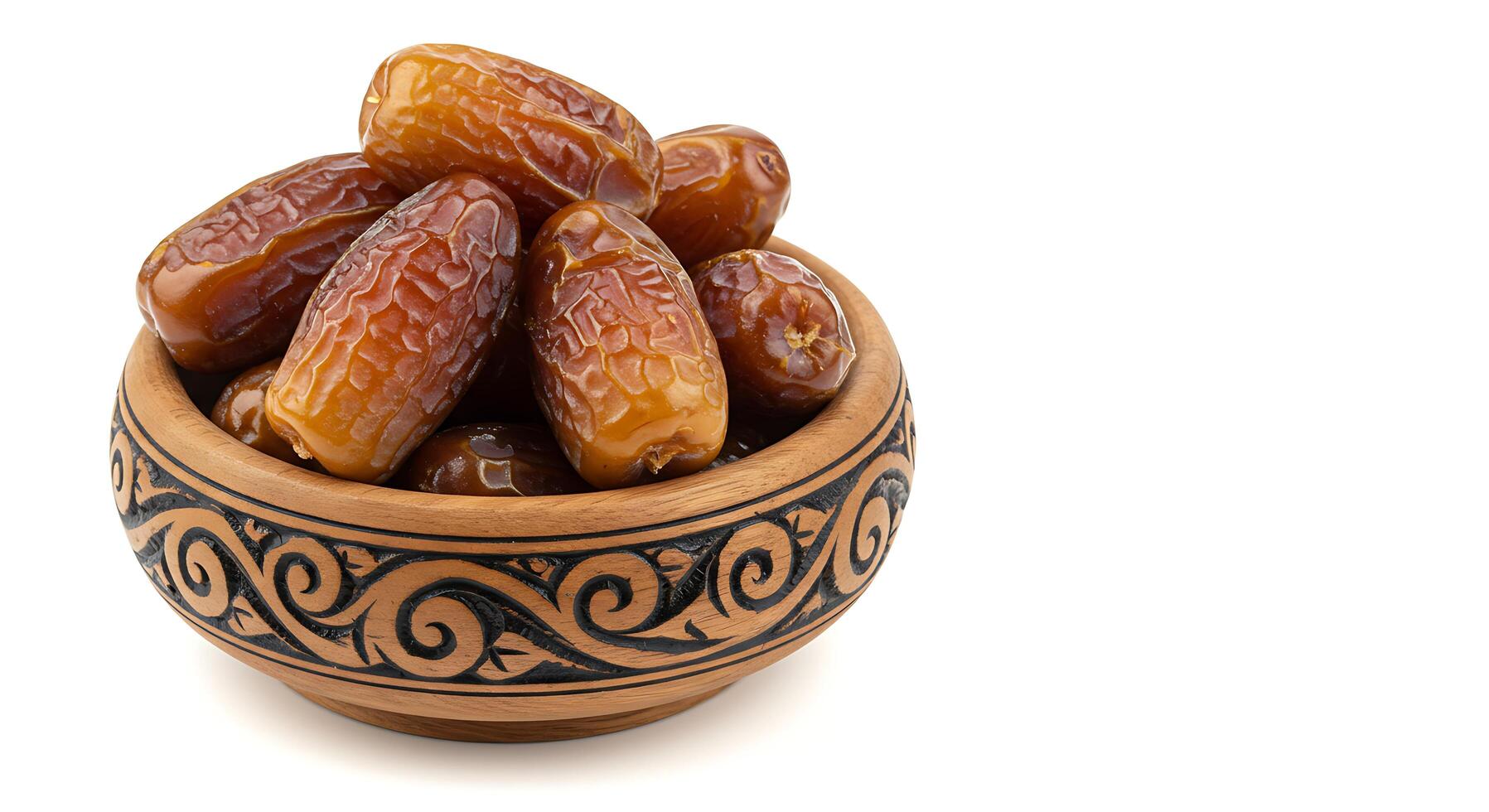 Sweet Dates in a Carved Wooden Bowl photo