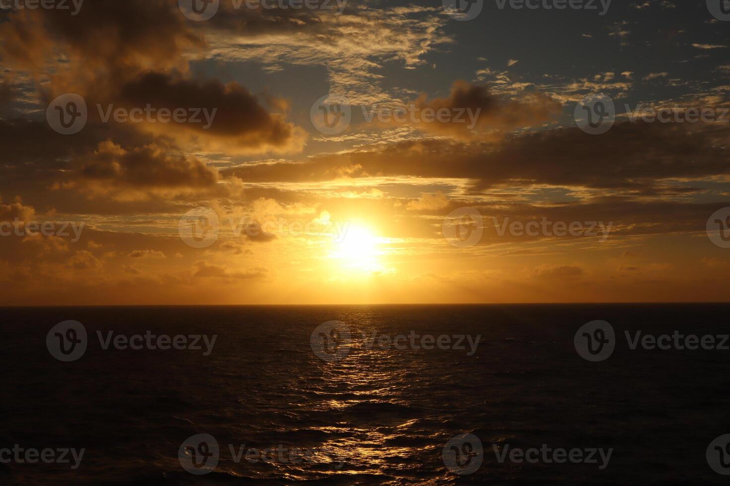 cloud and sunset over the ocean photo