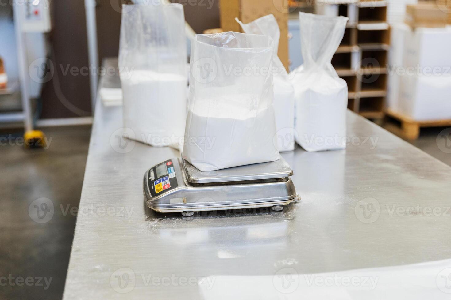 Close up of glucose in a plastic bag on a scale in a food processing facility photo