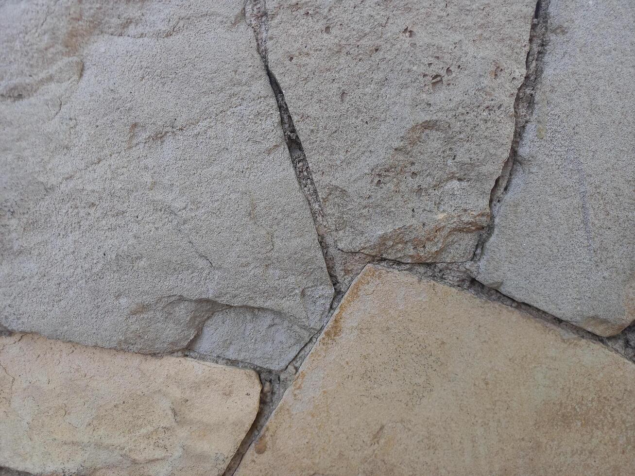 wall made of rocks in various shapes photo