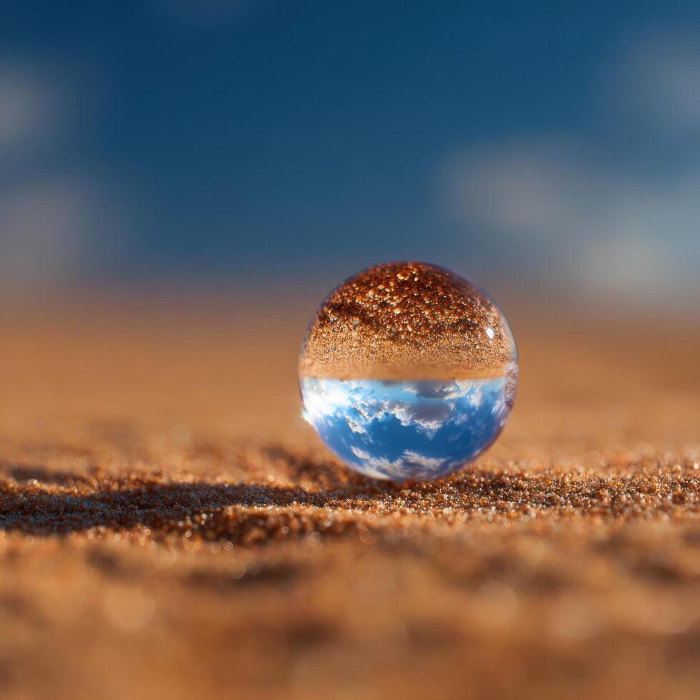 Macro Photograph Of A Single Water Drop On Dry Sand photo