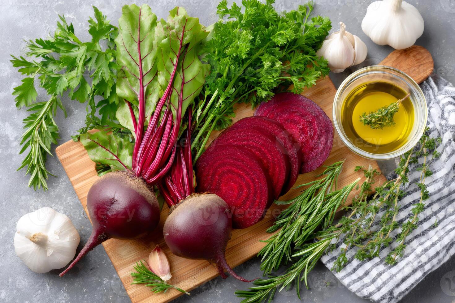 Fresh beets and herbs on a wooden board photo