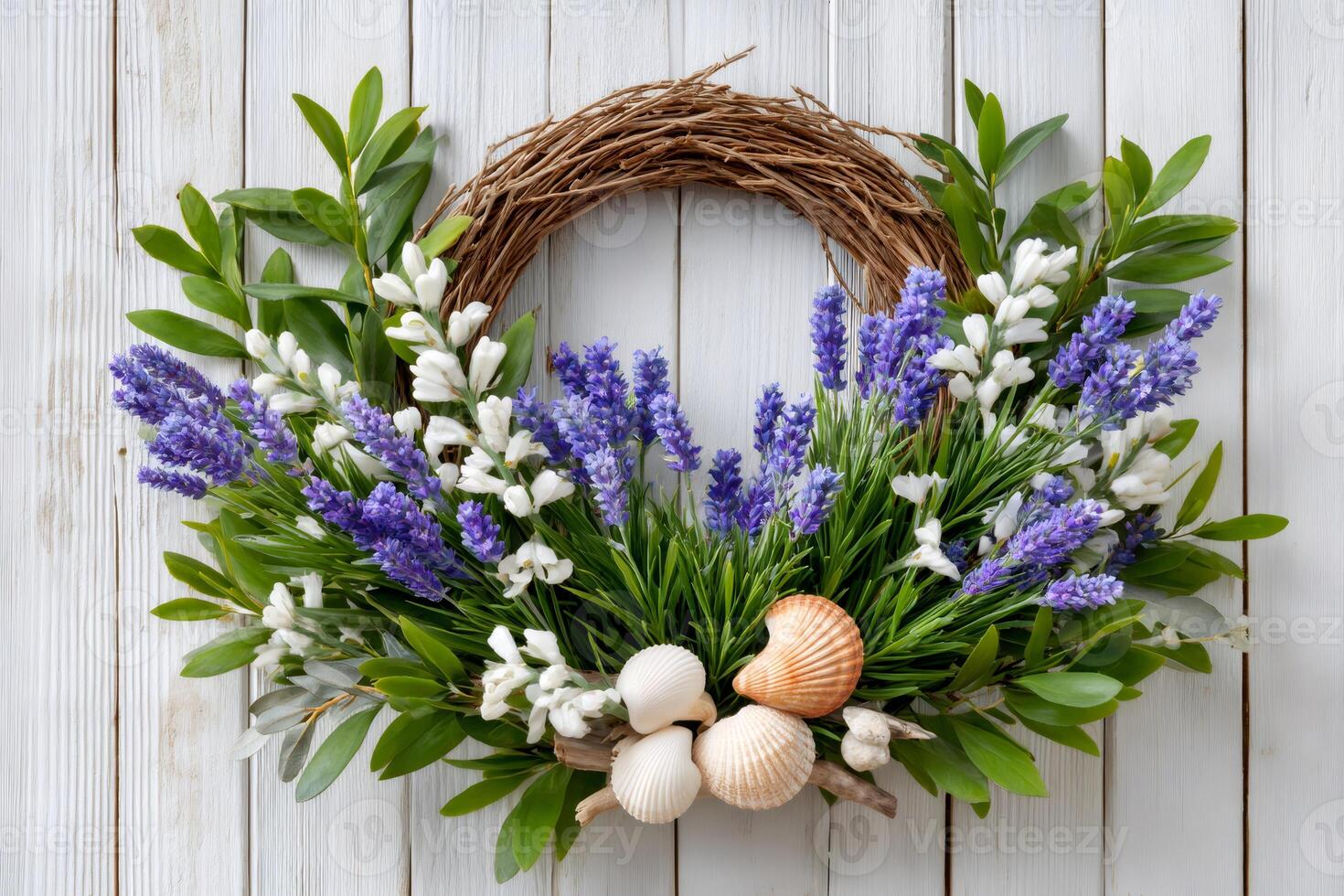 Lavender and white flowers decorating wicker wreath on white wooden background photo