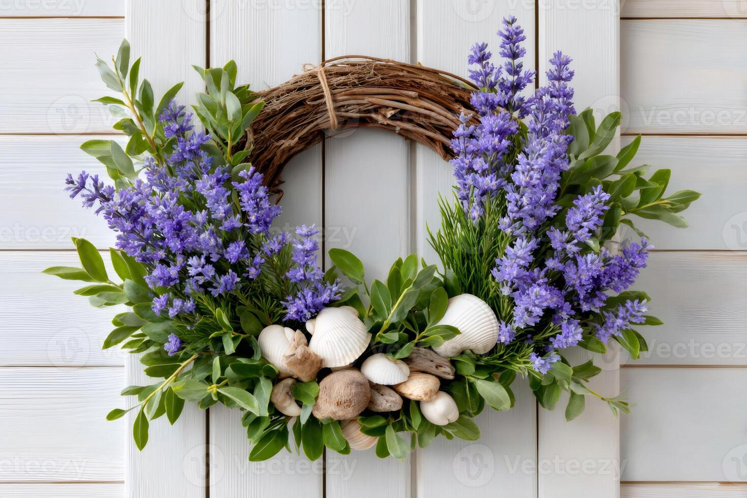 Lavender wreath hanging on white wooden planks with seashells and boxwood photo